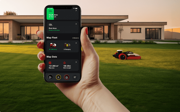 robot tondeuse Kress devant villa et en premier plan : main tenant un smartphone avec l'appli de pilotage